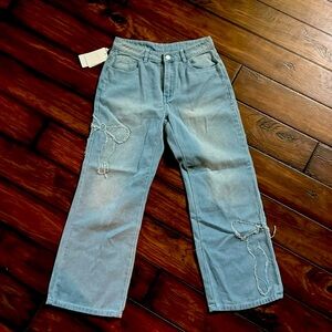 NWT light blue distressed jeans with bow stitching size M 160/88A